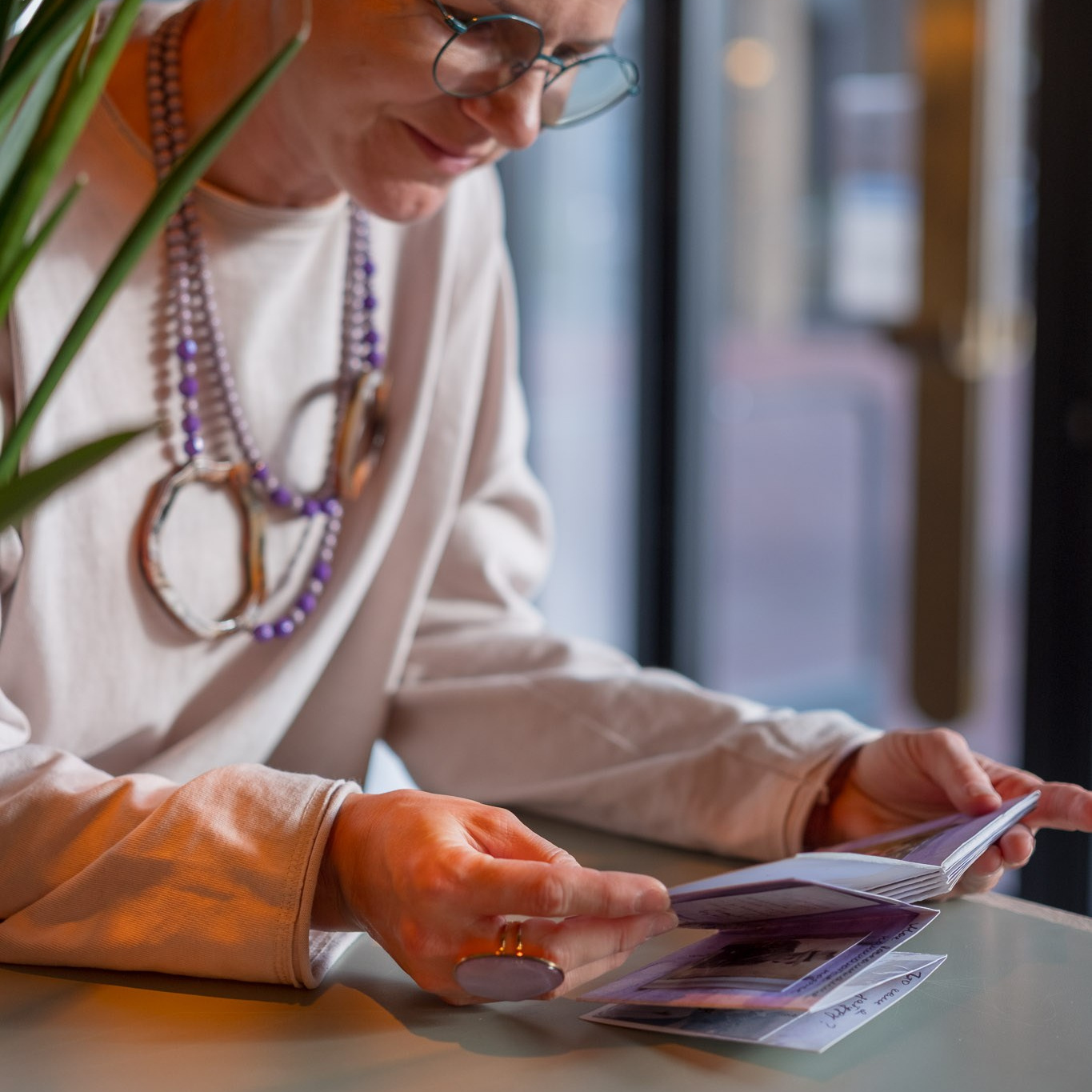 Handmade art zine 'The Present Exists' with archival family photos and dried flowers.