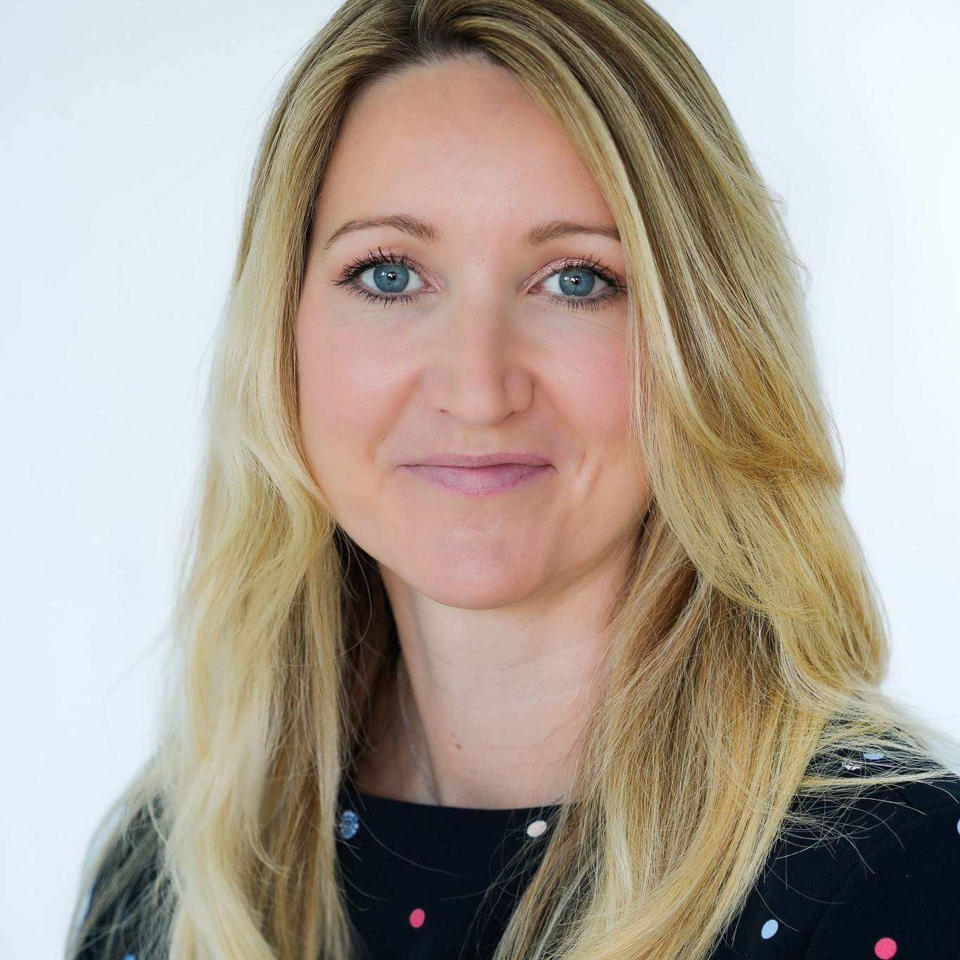 Professional headshot of blonde woman in Solihull studio, corporate portrait photography