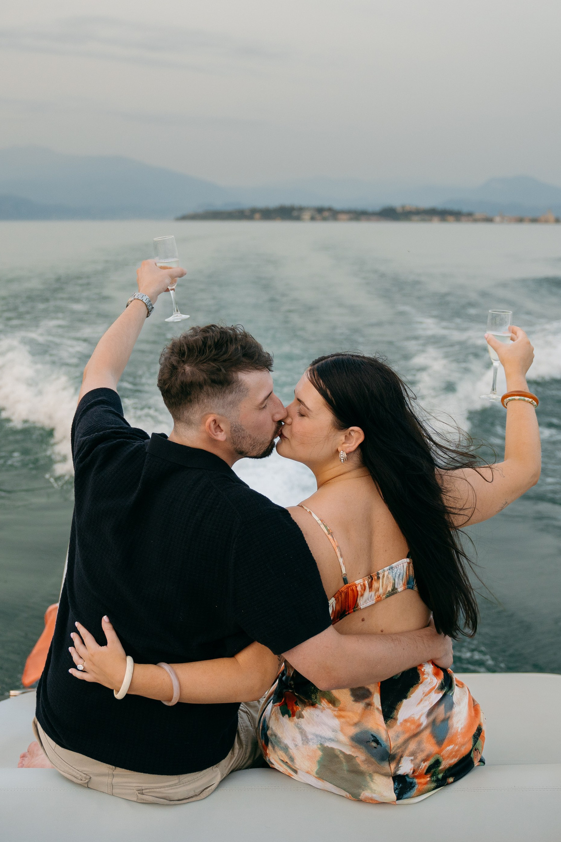 Elegant couple after engagement at Lake Garda, romantic proposal photography in Italy