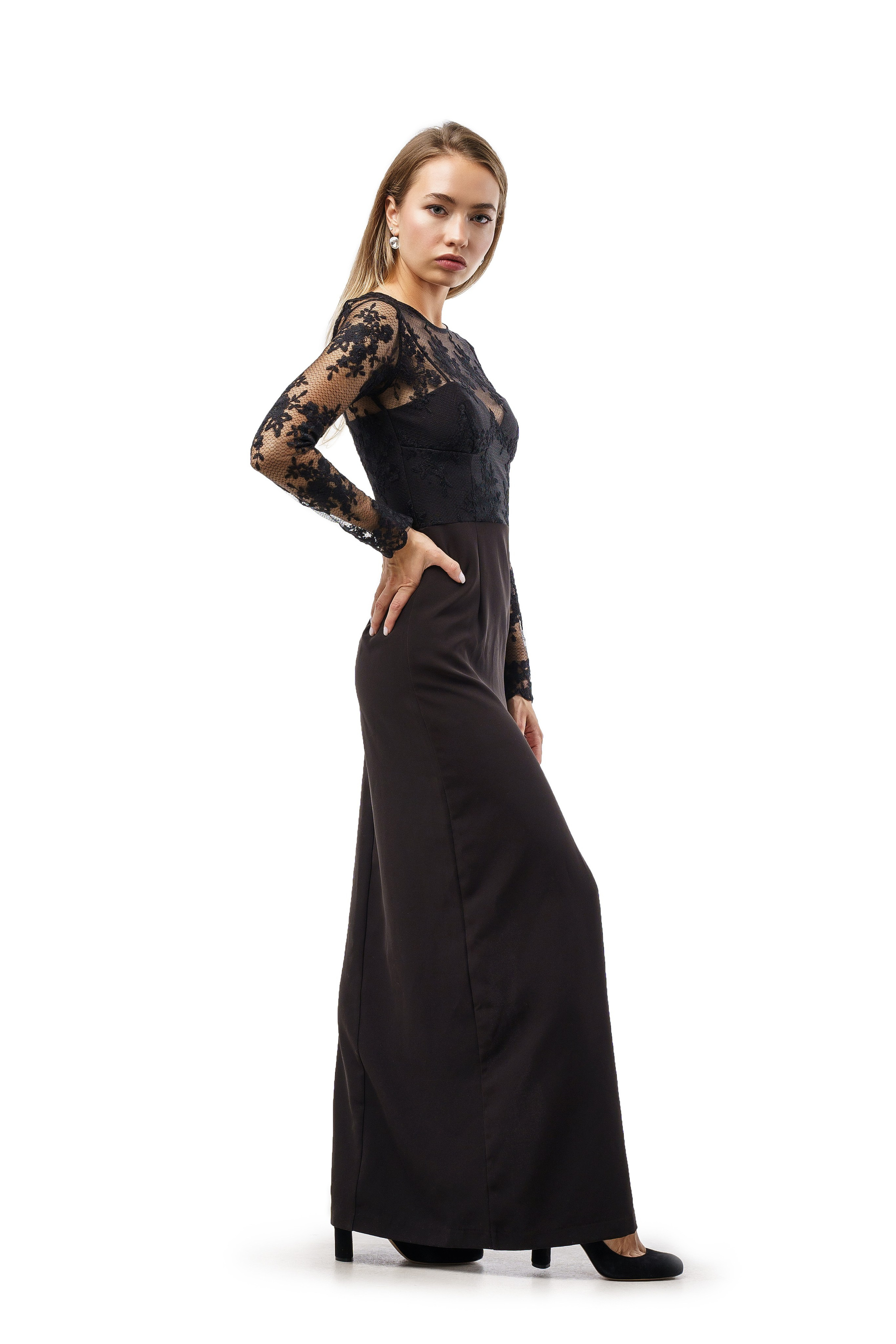 Elegant woman in a long black dress, side angle shot on a white background, advertising for a classic dress store