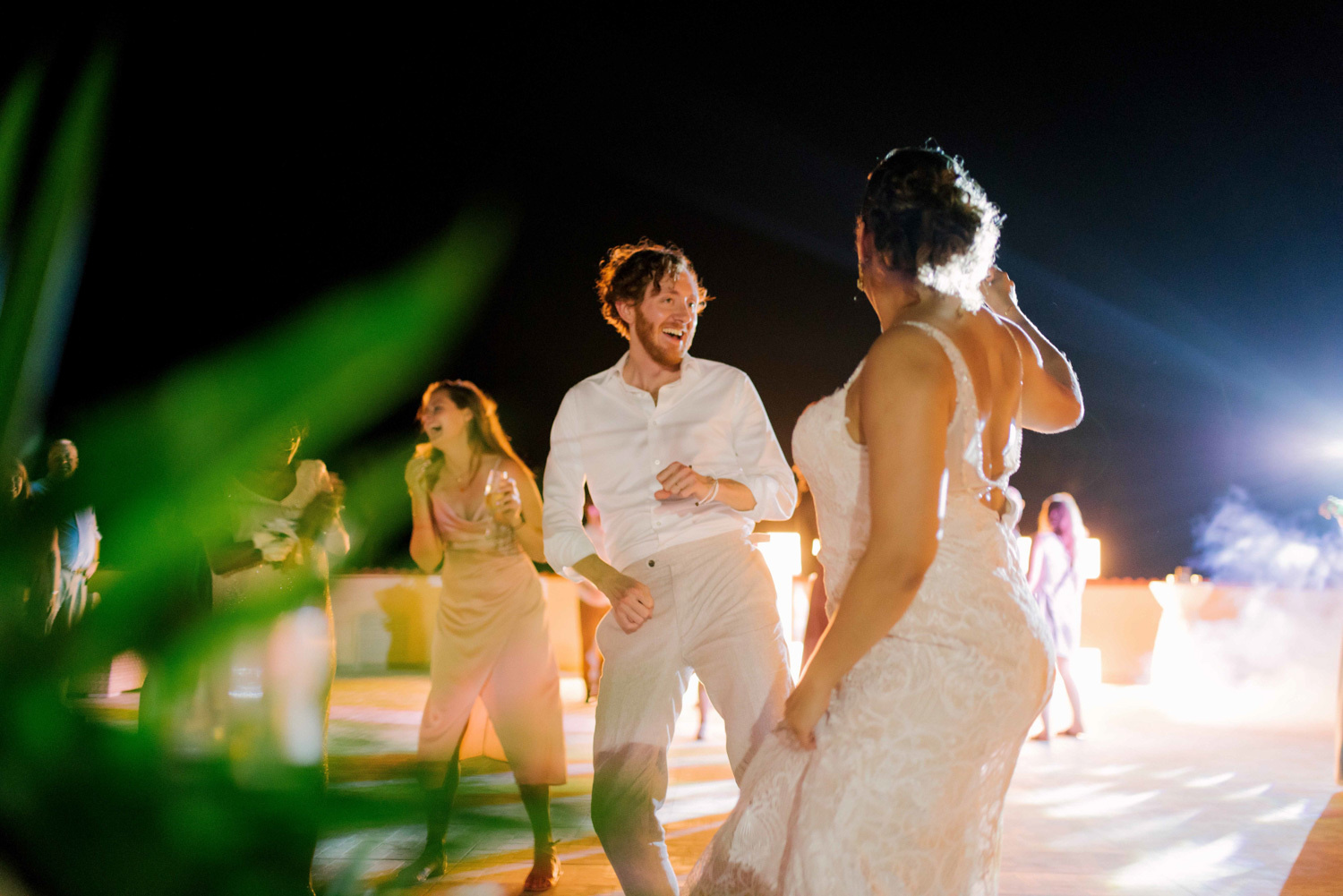 The newlyweds dance at their own wedding. 