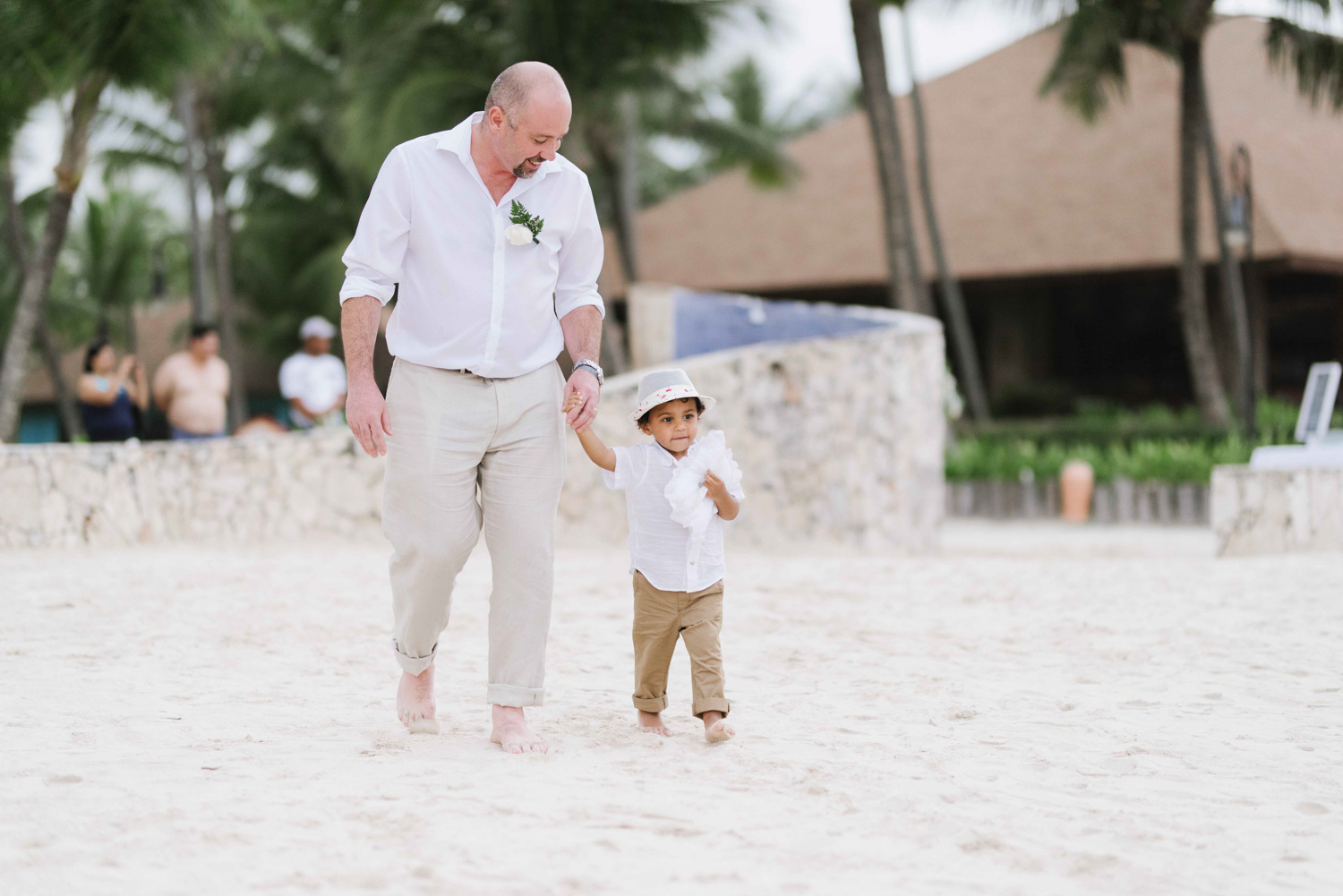 Guests walk to the ceremony venue. 
