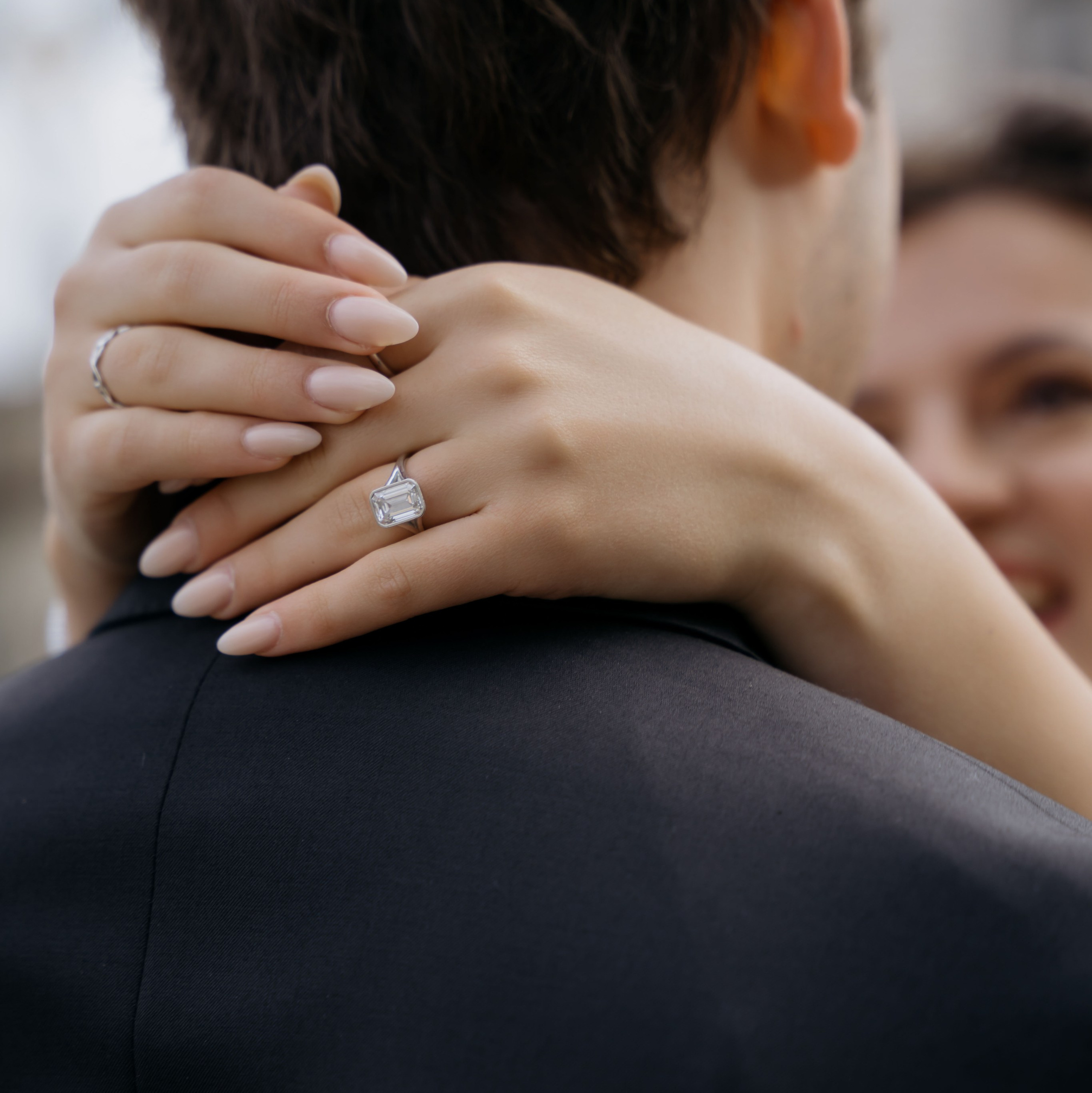 Close up of engagement ring during romantic London couple photoshoot.