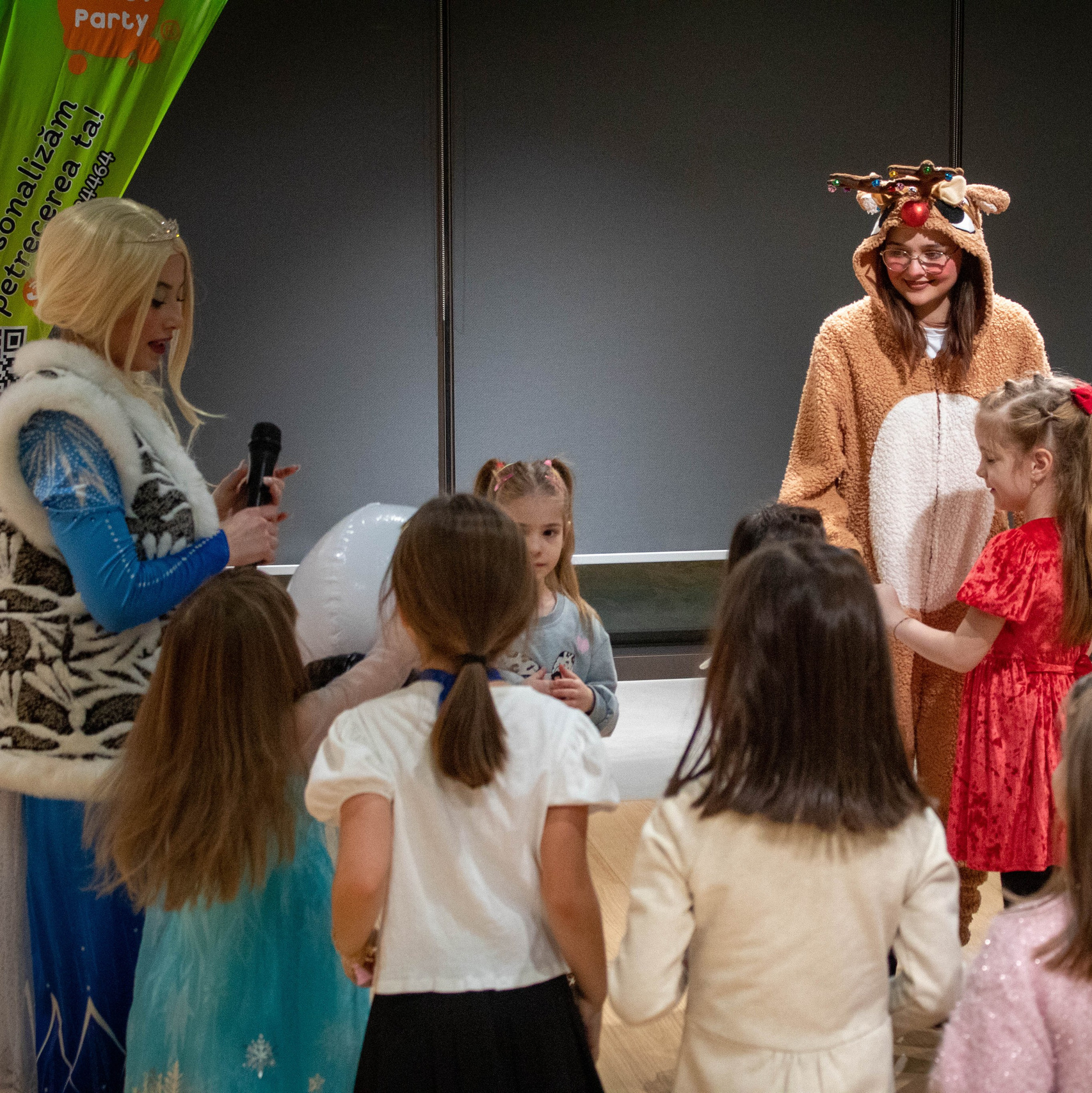 Santa Claus entertaining children during a Christmas celebration