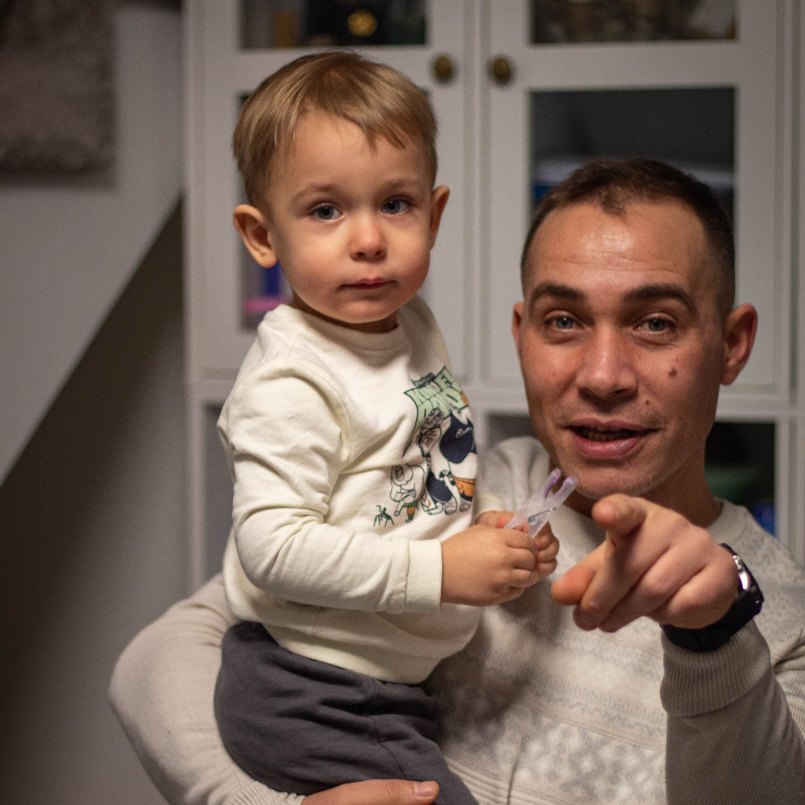 Family portrait with father and children sharing a warm embrace