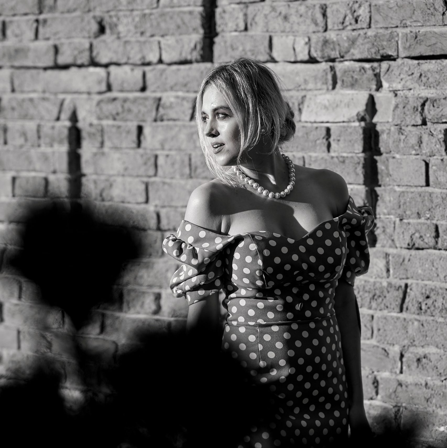 Black and white street portrait of a woman. Stylish urban photoshoot in Nj