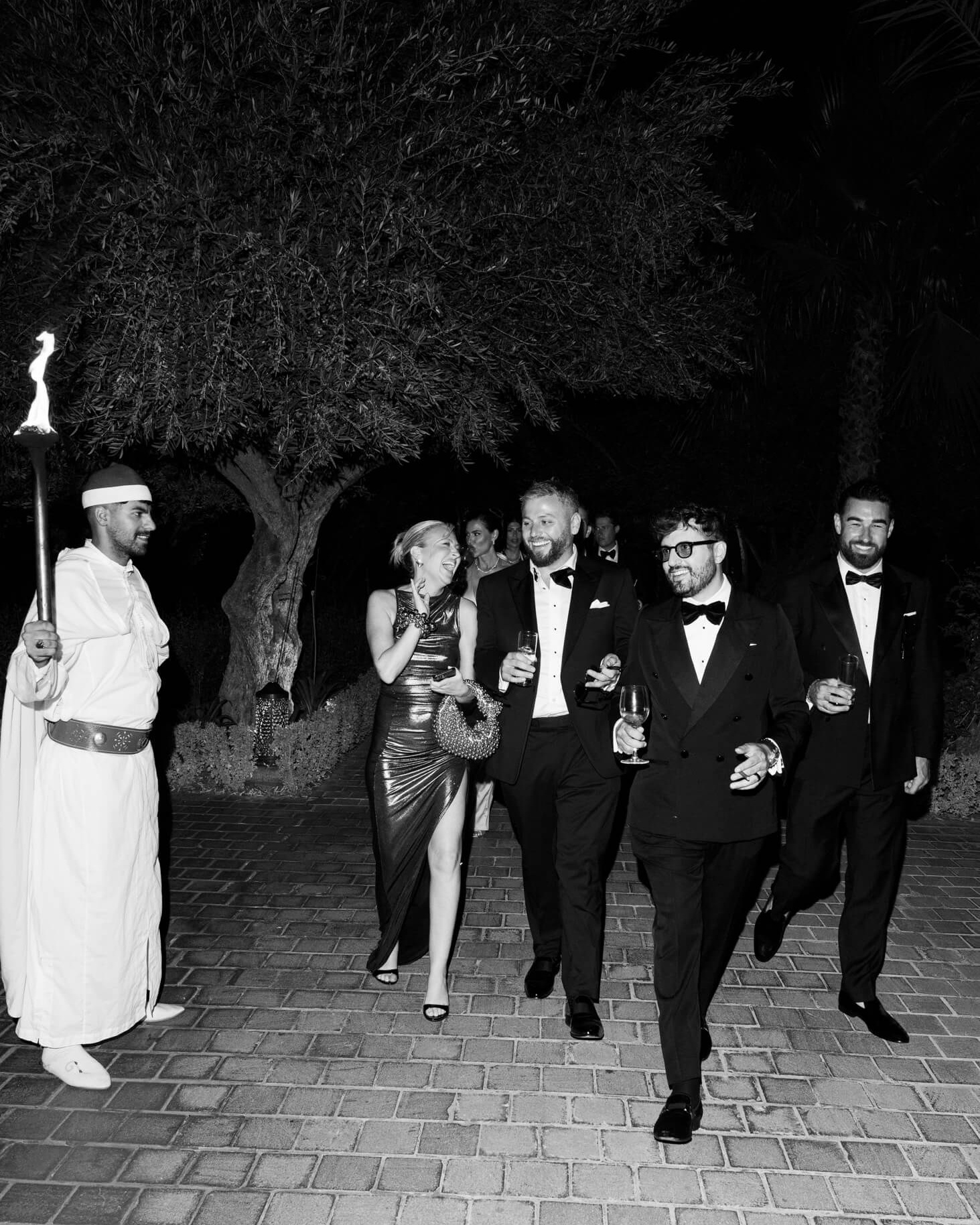 Guests walking into an evening wedding celebration during a luxury destination wedding in Marrakech