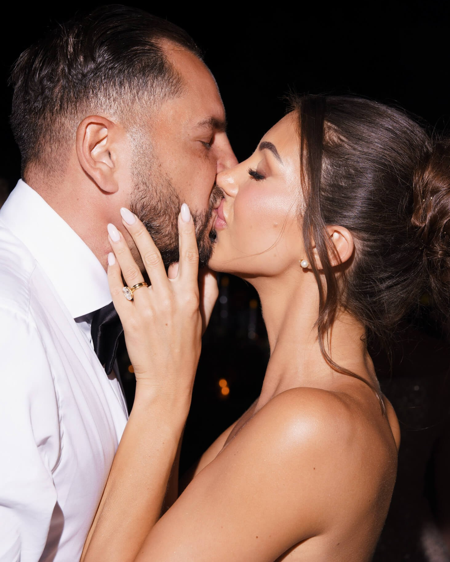 Bride and groom kissing in a close portrait during a stylish wedding celebration in Marrakech