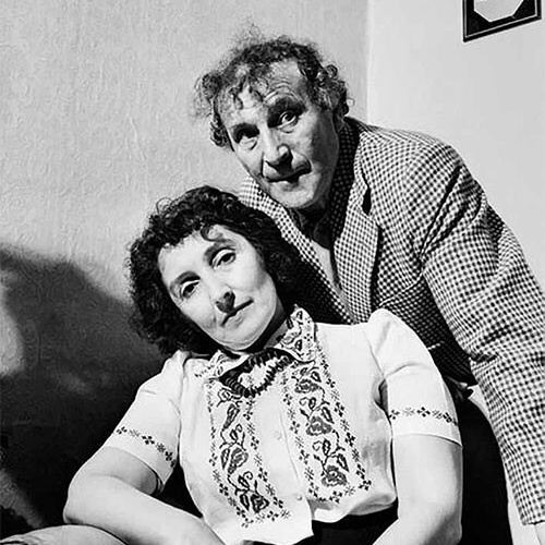This photograph captures the renowned artist Marc Chagall alongside his wife and muse, Bella Rosenfeld