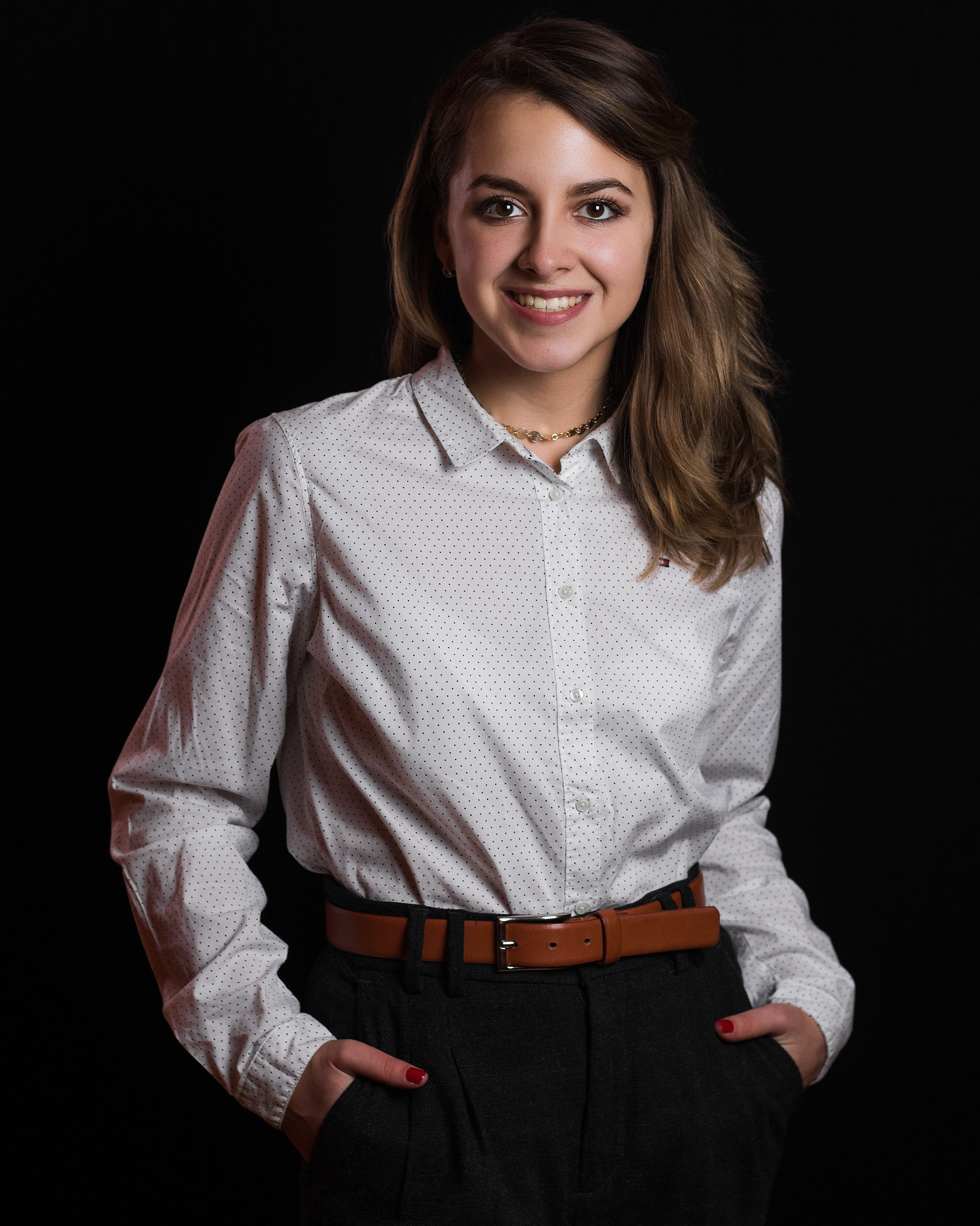 Corporate headshot woman white shirt friendly expression studio lighting Spruce Grove