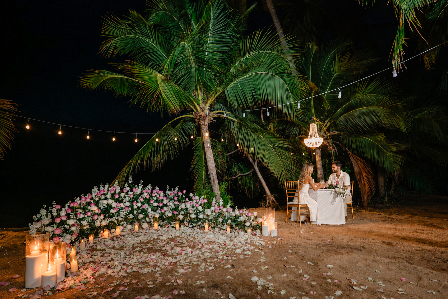 Luxury marriage proposal on a private beach in Koh Samui with flower decorations and romantic lighting.