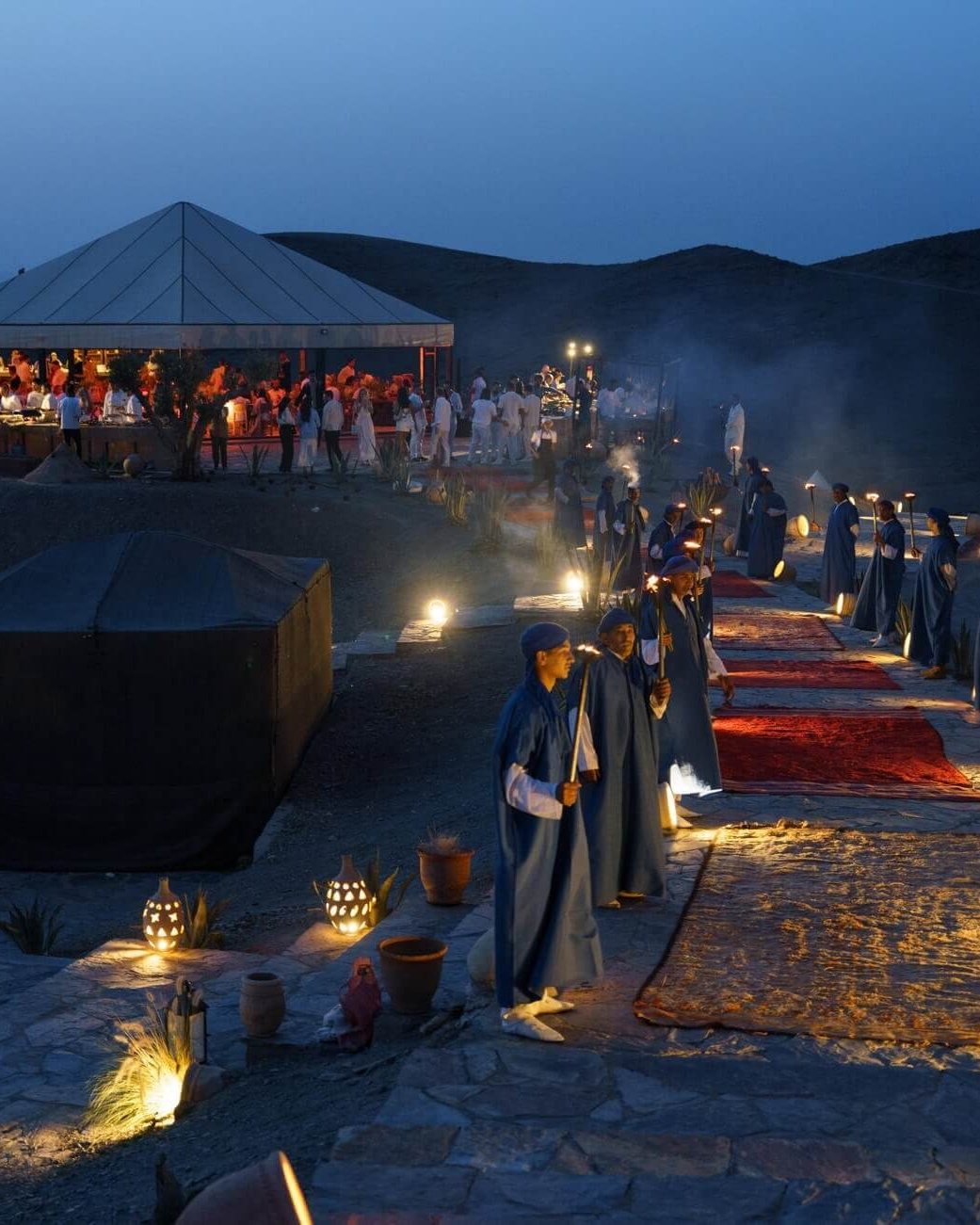 Pre-wedding celebration in Agafay Desert with candlelight, tents and evening views near Marrakech