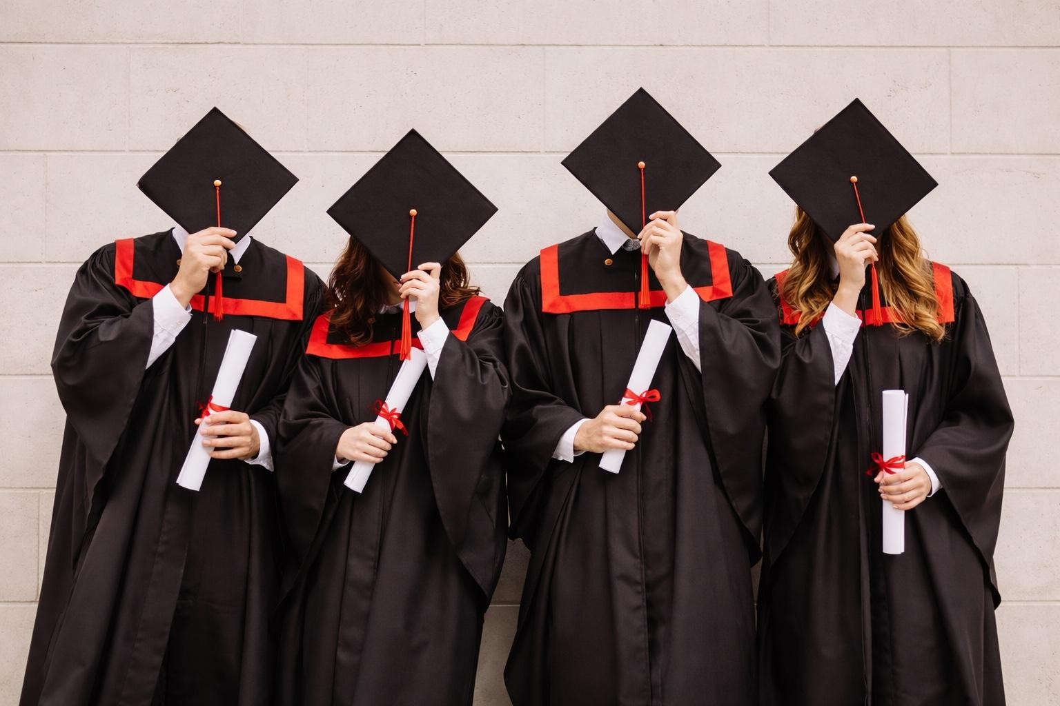 Graduation cap throwing at sunset near Ancient Theatre in Plovdiv, student celebration