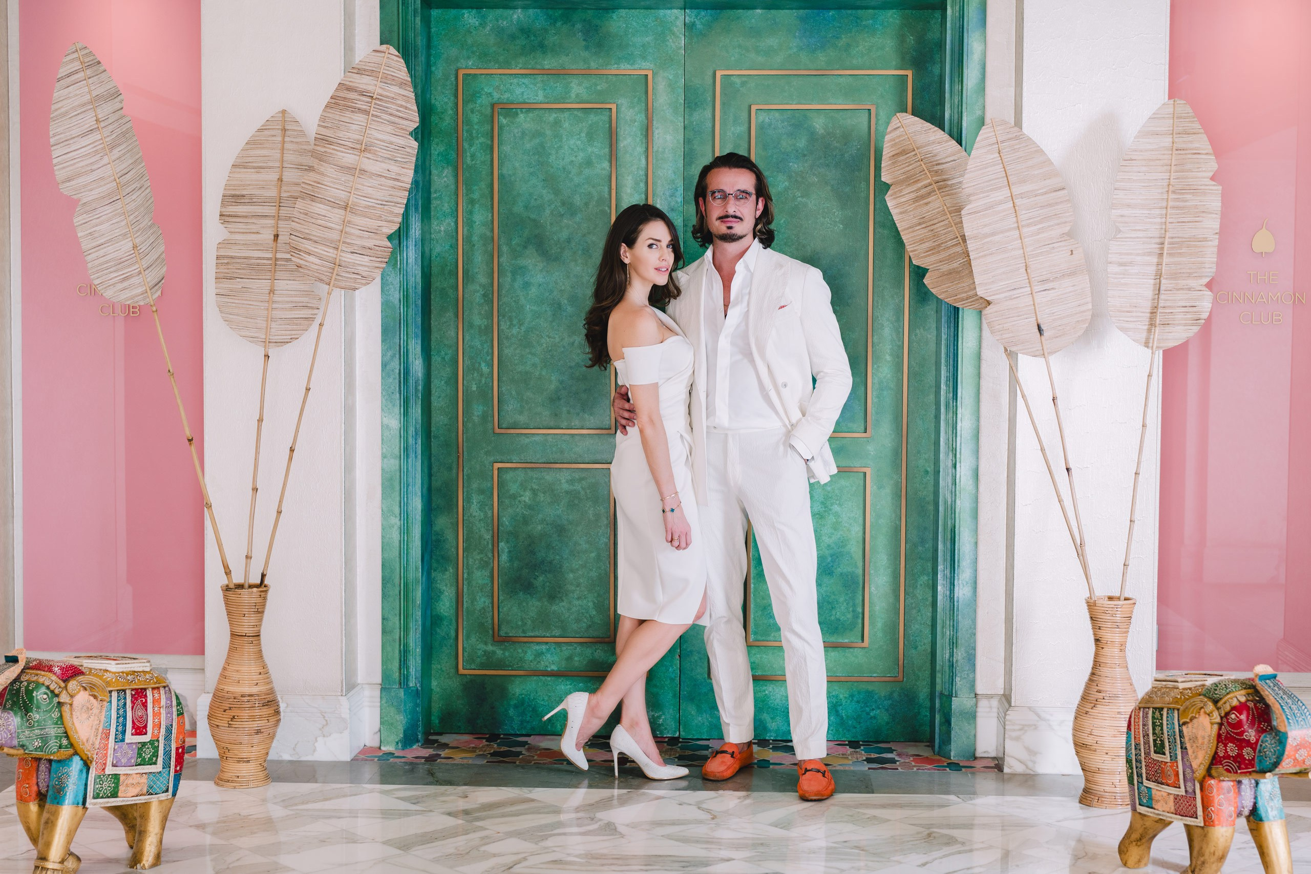 Couple dressed in white posing in Tbilisi