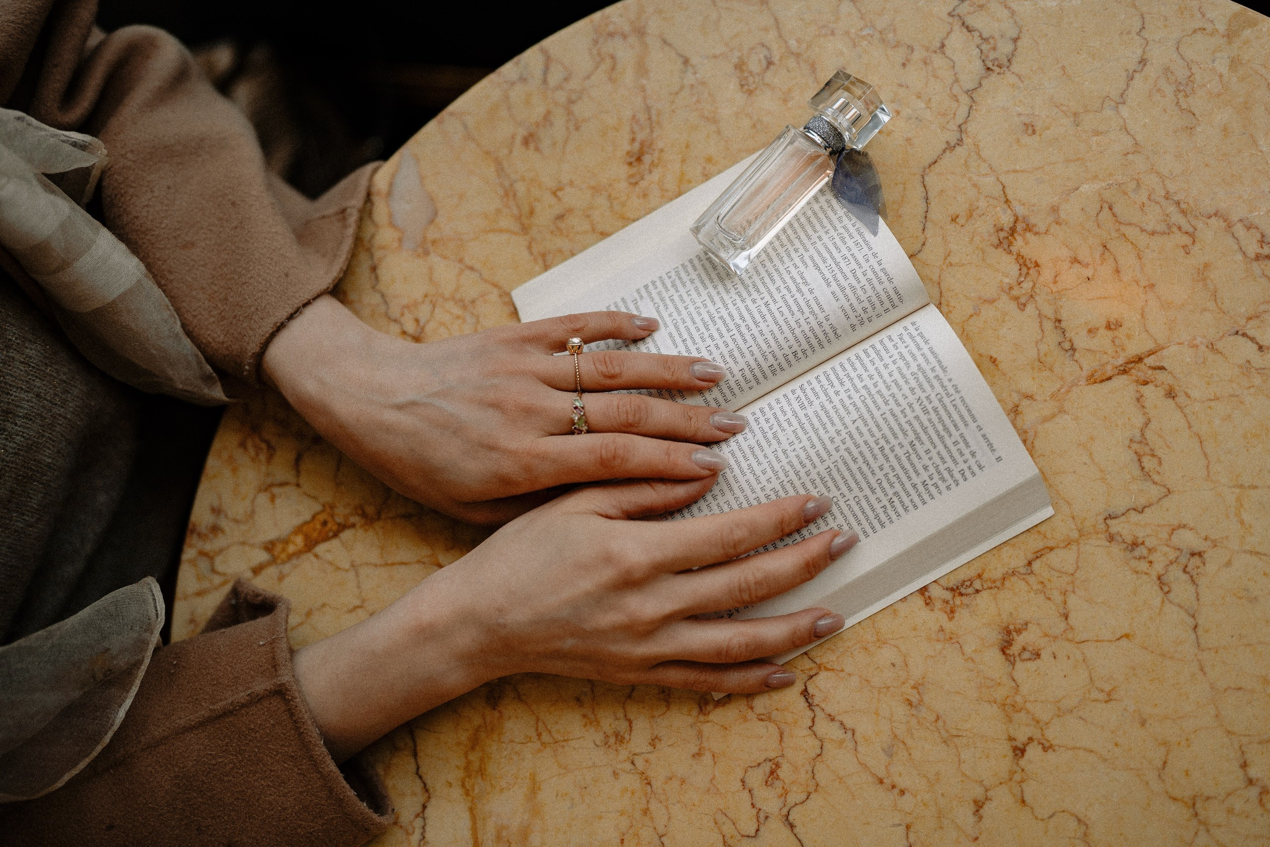 Girl readin a book in a cafe in Madrid.
