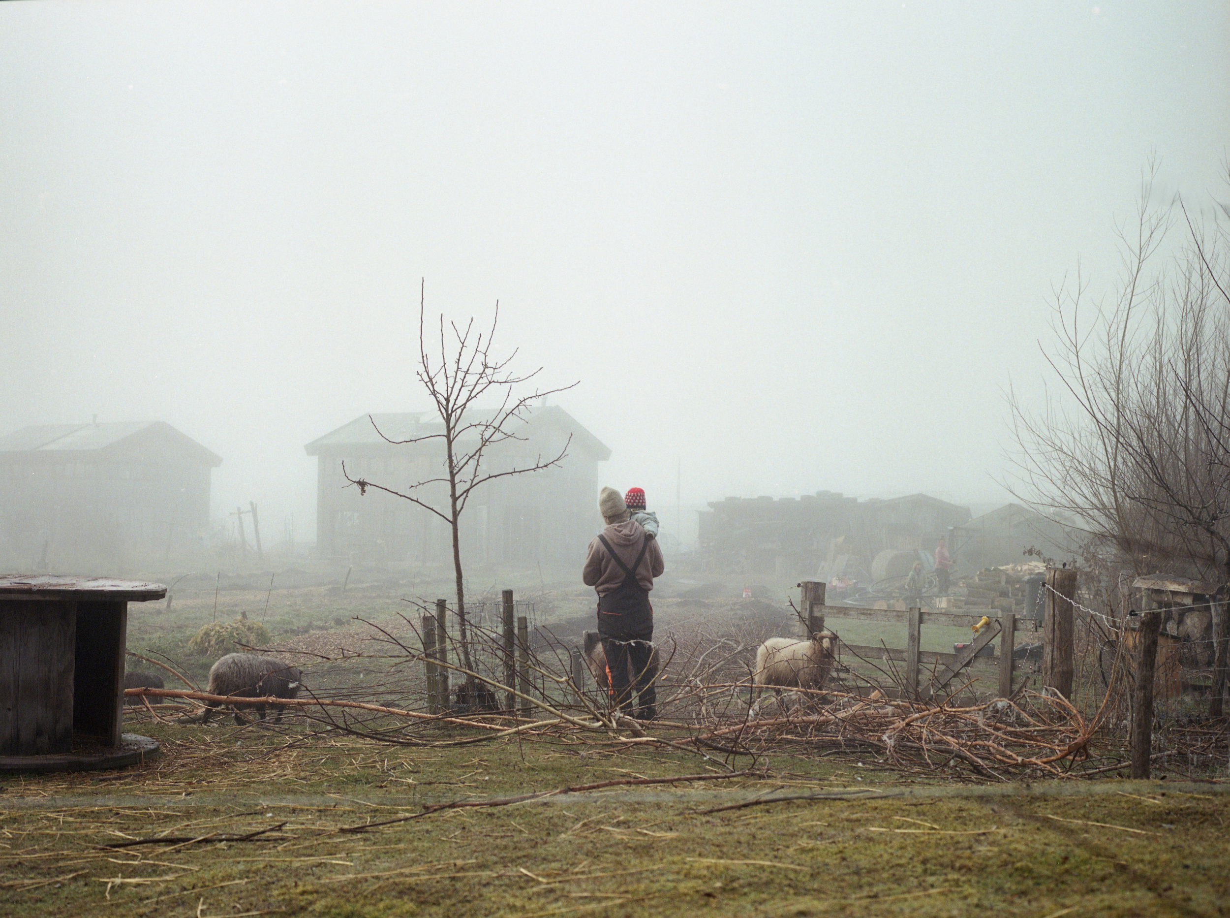 Floris with child surrounded by his garden, Oosterwold the Netherlands photo made on a medium film camera.