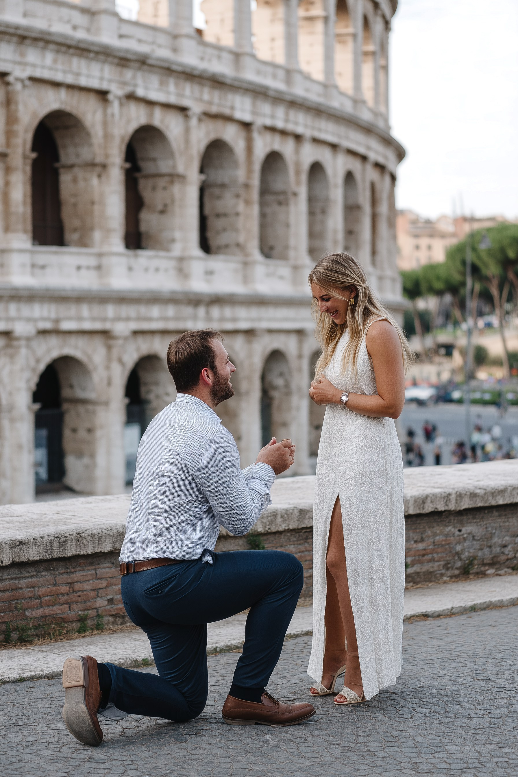 A man proposes to his girlfriend in front of the Colosseum in Rome — she smiles, touched by the moment.