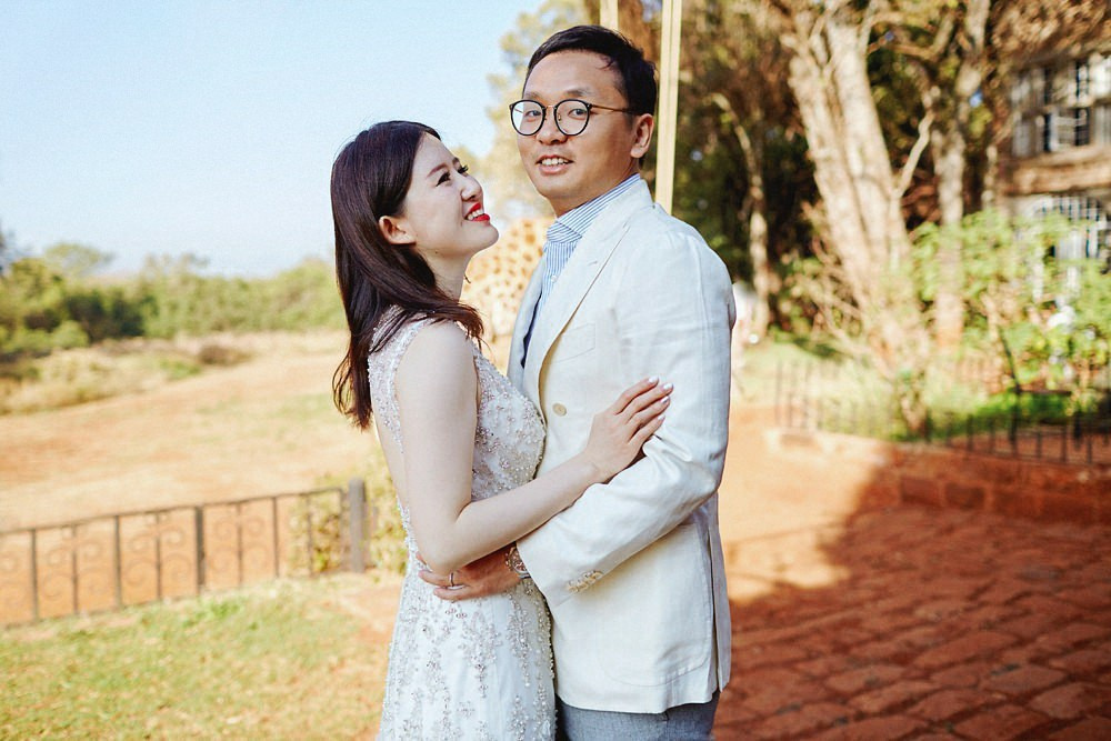 Romantic wedding dress portraits in Giraffe Manor courtyard