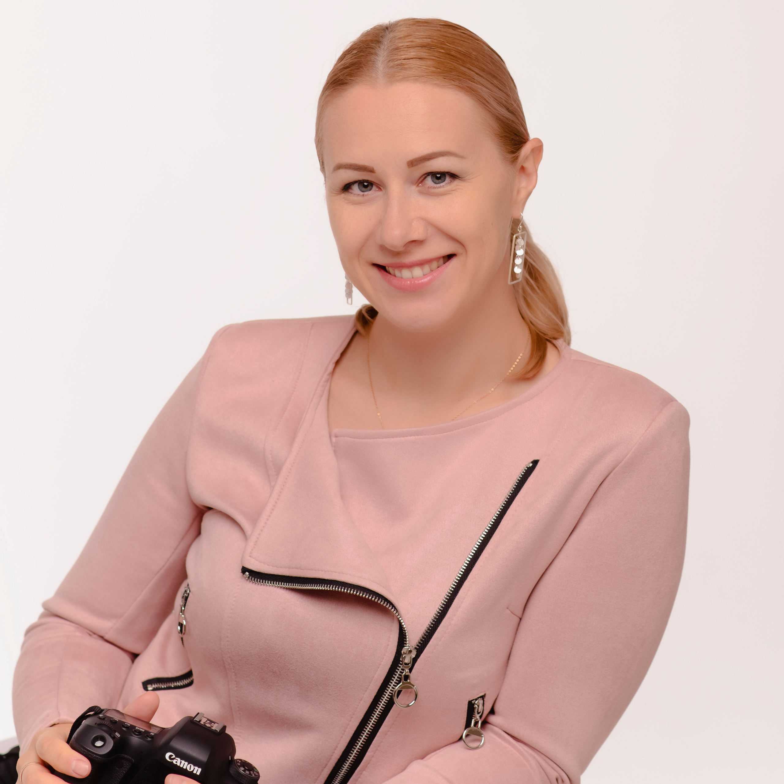 Portrait of a girl in pink coat. She is a family and event photographer in the city of San Jose and Fremont CA