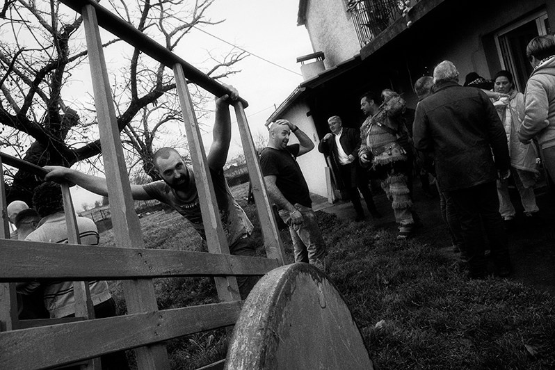 The boys and the “Caretos” stop at the house of a villager and take the opportunity to gain more strength, Bragança municipality, Bragança district, Trás-os-Montes region, Portugal. 2022