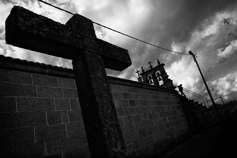 Man walks down the steps of a church staircase, Montalegre municipality, Vila Real district, Trás-os-Montes region, Portugal. 2016