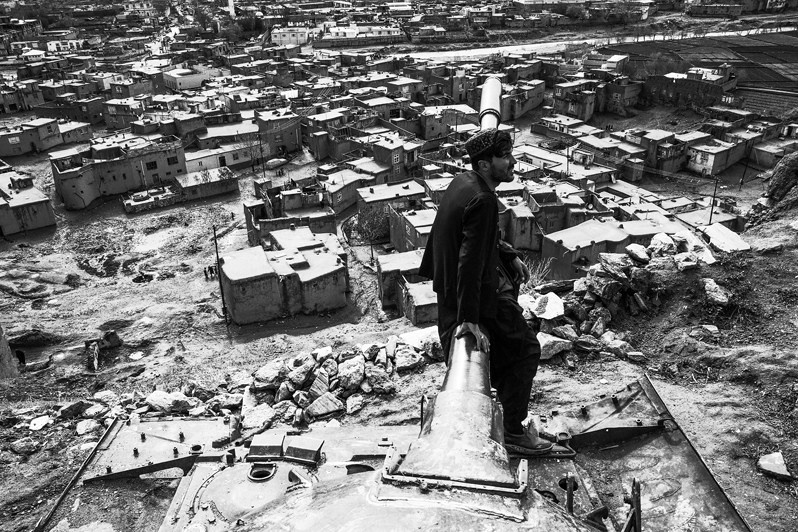 Afghan tourists and locals enjoy taking photos with tanks and cannons, Ghazni, Afghanistan. 2024