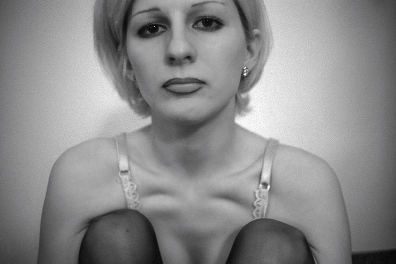 Portrait of a woman of "easy virtue" at the "Oktyabrskaya" Hotel, Vosstaniya square, St Petersburg, Russia. 2001 © Oleg Klimov
