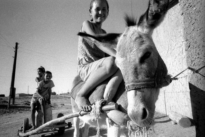Children’s spends a considerable part of his day fetching fresh water for his family, Bogen village, Aralsk district, Kyzyl-Orda region, Kazakhstan. August 2001