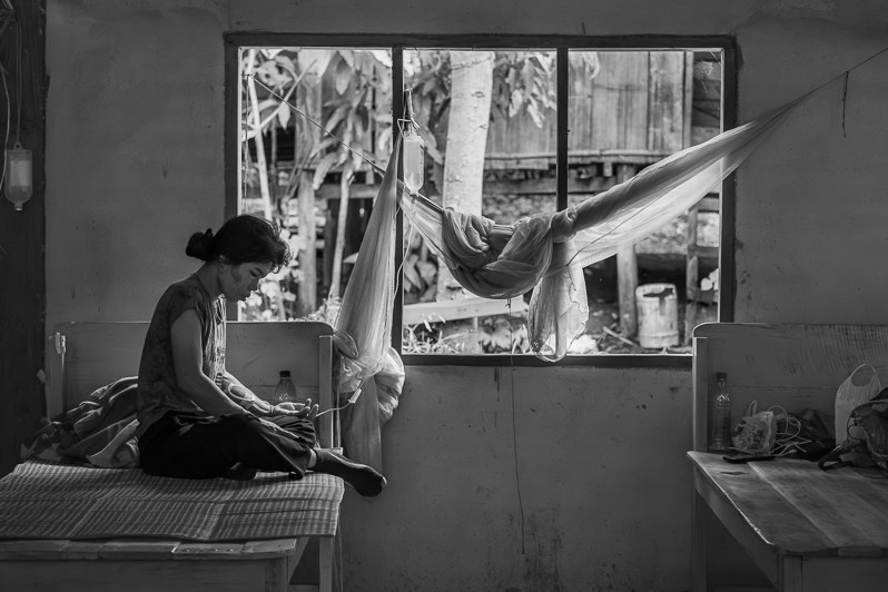 Patient at a rural clinic for displaced persons affected by the civil war, Kayin State, Myanmar. October 2023