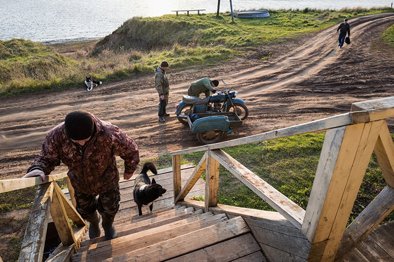 On the porch of the village shop, Yuroma village, Leshukonsky district, Arkhangelsk region, Russia. 2021