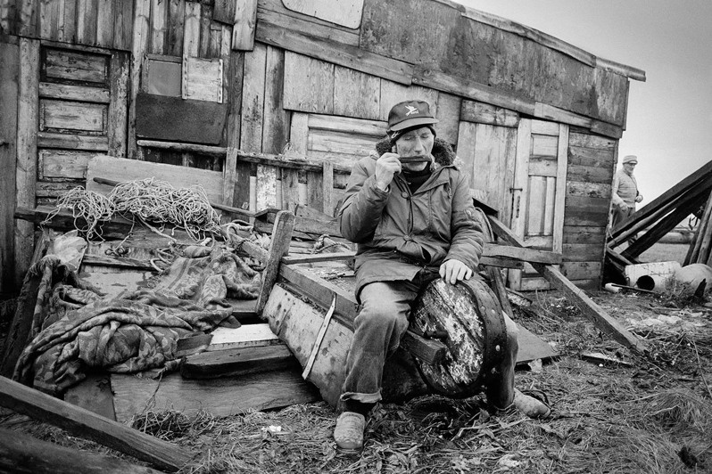 Guðmundur Árnason broke his rule about taking the “white” and “black” harmonicas out only once a year. Playing the “white” harmonica, Mýrar farm, Ísafjördur district, Westfjords region, Iceland. 1996