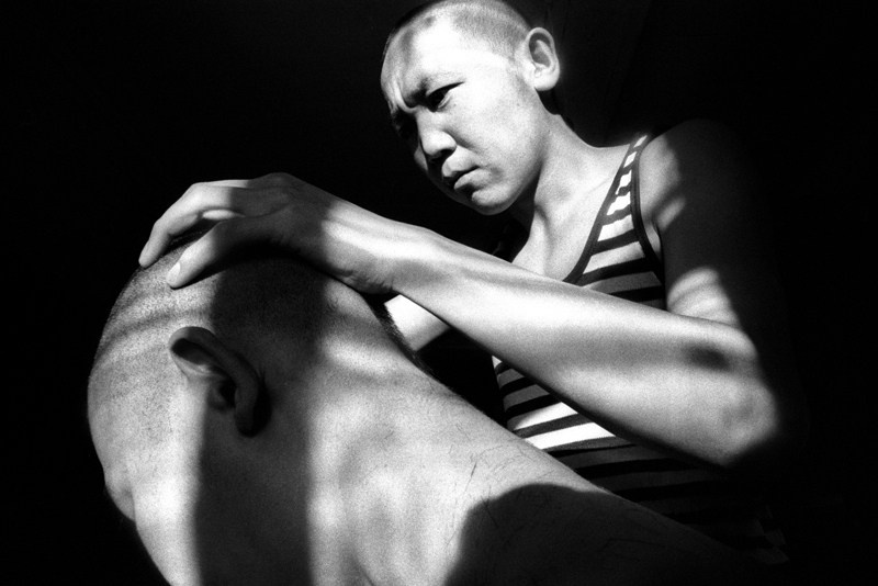 Regular shaving of each other's heads by students in one of the camp barracks, Verkhnyaya Ivolga village, Buryatia, Russia. November 2001