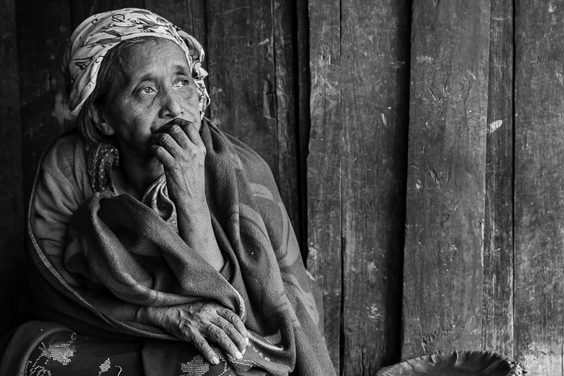 An elderly Chin woman from Lautu region, Tisenb village, Chin state, Myanmar. September 2022