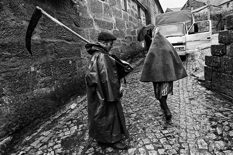 Man with a scythe going to work, Boticas municipality, Vila Real district, Trás-os-Montes region, Portugal. 2015