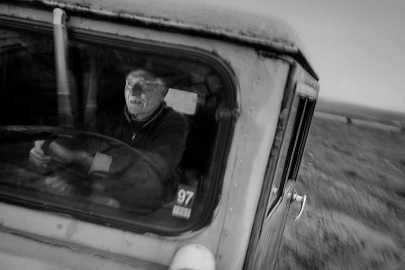 Eirikur drives his old Dodge Weapon over the potholed roads, Svinadalur valley, Vestur-Skaftafellssýsla district, Iceland. 1997