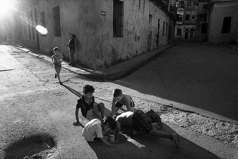 Children playing at an intersection in the Los Sitios neighbourhood, Centro Habana district, Havana, Cuba. 2023