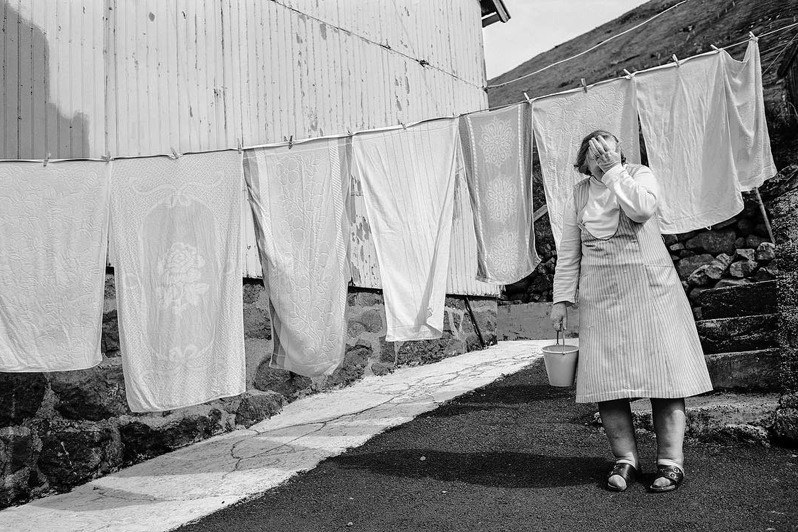 Olivia Kerlok at hanging laundry, Hattarvik village, Fugloyar municipality, Faroe Islands, Kingdom of Denmark. 1988