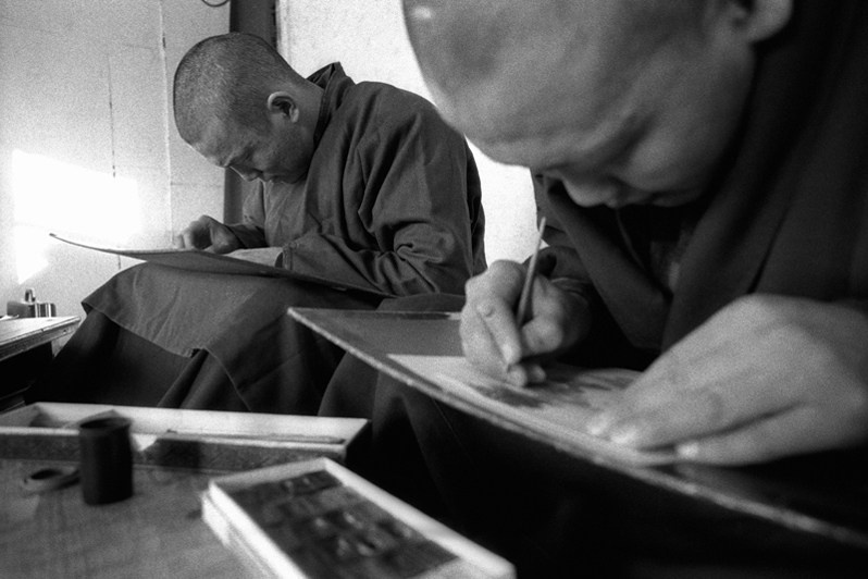 Buddhist students during a thangka painting course, Verkhnyaya Ivolga village, Buryatia, Russia. November 2001