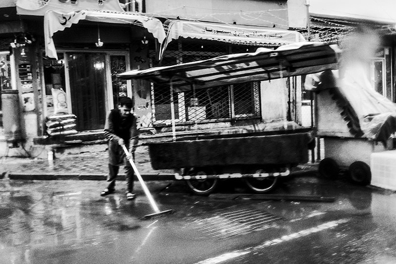 Daytime street cleaning after the evening feast, Shur Bazar, Kabul, Afghanistan. 2024