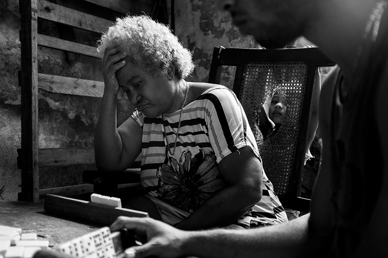 Game of dominoes in one of the neighbourhoods of Jesús María county, Centro Habana district, Havana, Cuba. 2021