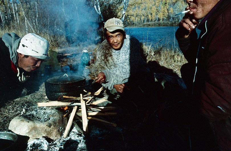 A bowl of homemade vodka shared with a family in the steppe, Tsagaan-Üür district, Khövsgöl province, Mongolia. October 2010