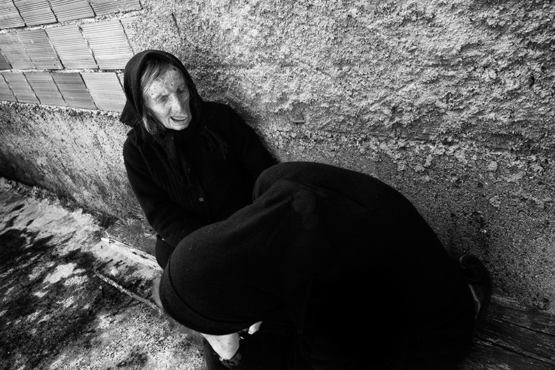 Two women tell each other about their sad life, Montalegre municipality, Vila Real district, Trás-os-Montes region, Portugal. 2016