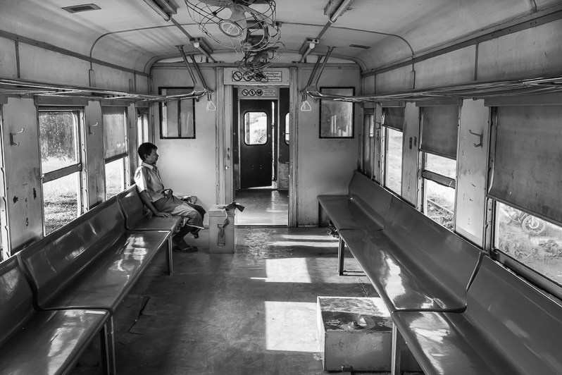 A Rohingya ice cream seller taking the train to go selling ice creams in IDP camps, Rakhine state, Myanmar. September 2019