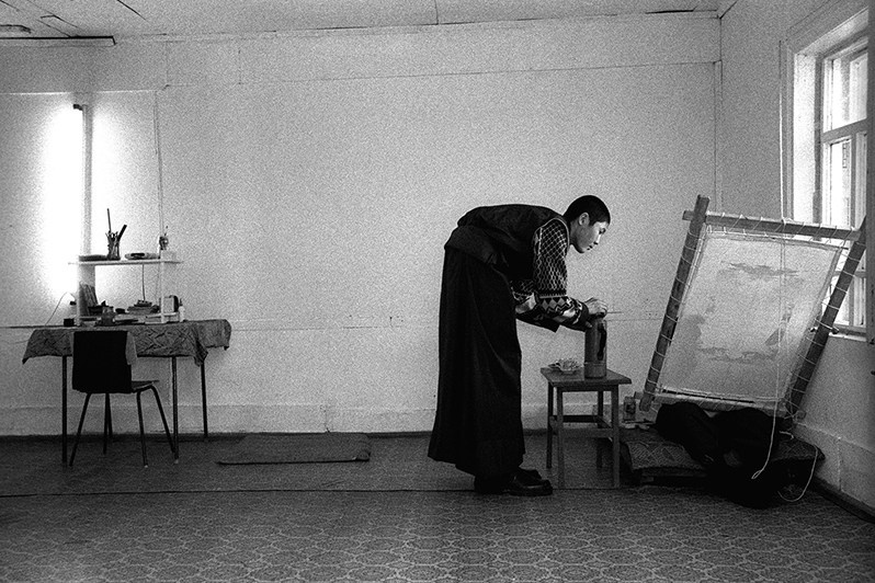 Buddhist student in a workshop teaching the art of thangka , Verkhnyaya Ivolga village, Buryatia, Russia. November 2001