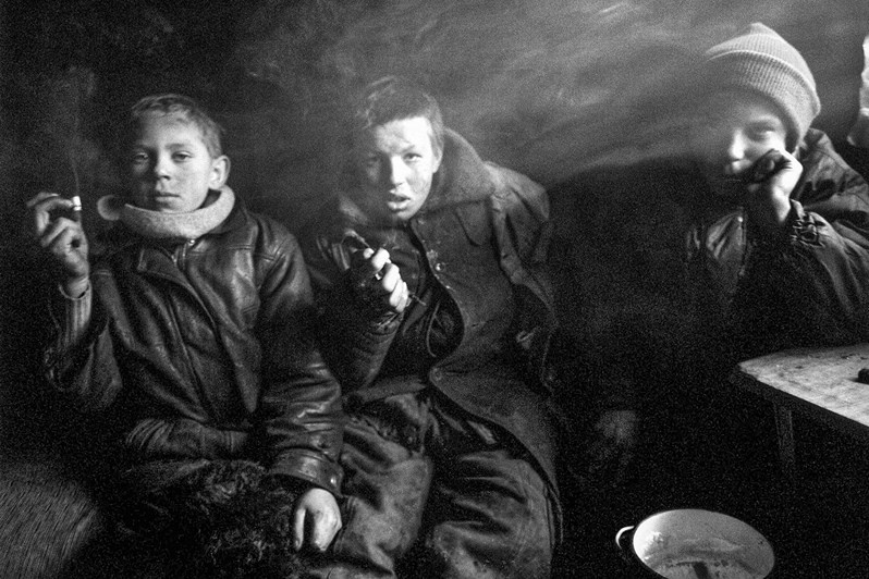 Homeless children at a rubbish tip on the outskirts of Moscow, in the shed where they live, near Salaryevo village, Leninsky district, Moscow region, Russia. 2007 © Oleg Klimov