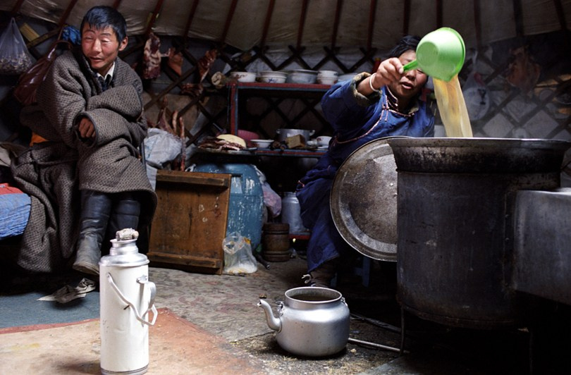Lady preparing salted tea, Khövsgöl province, Mongolia. September 2009