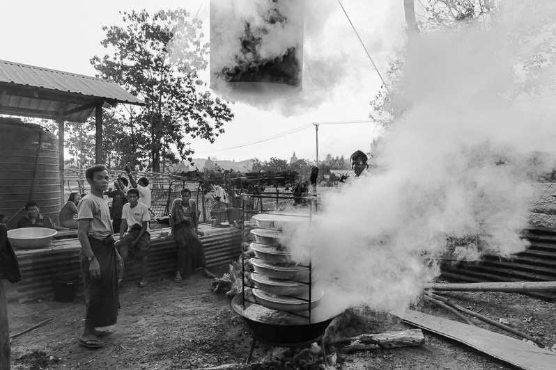 Arkanese IDPs cooking rice for the 400 people that found shelter in a monastery, Chit Thaung Monastery IDP Camp, Mrauk-Oo, Rakhine State, Myanmar. February 2020