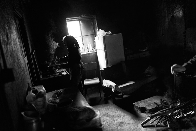 Cooking breakfast after morning animal care, Montalegre municipality, Vila Real district, Trás-os-Montes region, Portugal. 2016