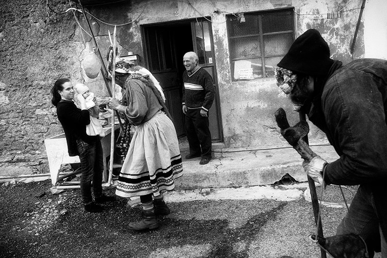 The “Galdrapa” during the “Peditório” under the watchful eye of the “Velho” with his “Saint Cipriano” cross always in his hand, Miranda do Douro municipality, Bragança district, Trás-os-Montes region, Portugal. 2019