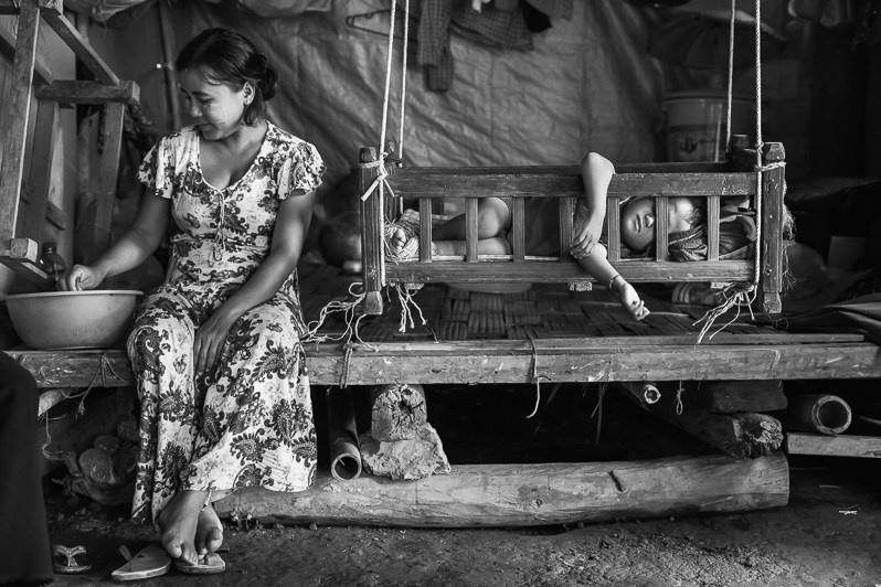 Internal displaced person and her child that fled from Baung Wheit village in April 2019 after shelling of the village found refuge at the nearby Maut Thein Monastery, Mrauk Oo township, Rakhine state, Myanmar. October 2019